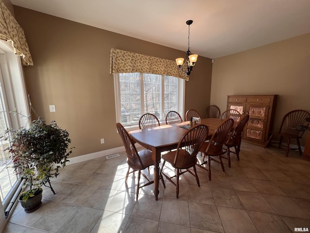 dining room with a chandelier, visible vents, baseboards, and light tile patterned floors