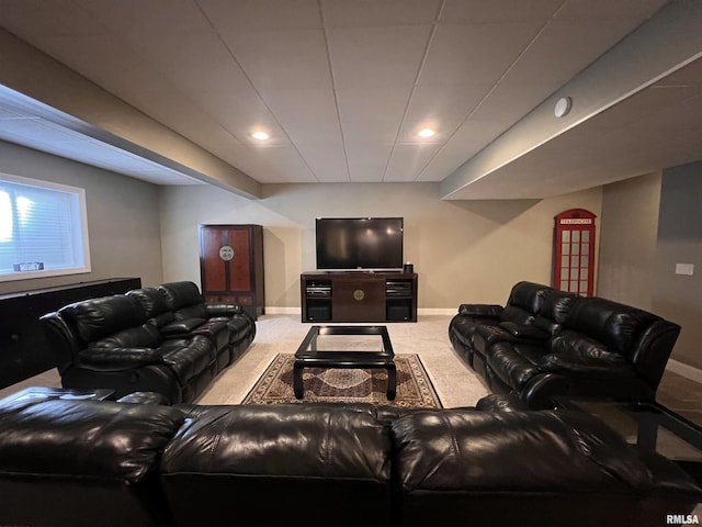 living room featuring carpet floors and baseboards