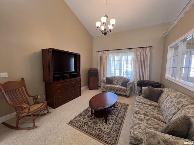 carpeted living room with a chandelier, a healthy amount of sunlight, high vaulted ceiling, and baseboards