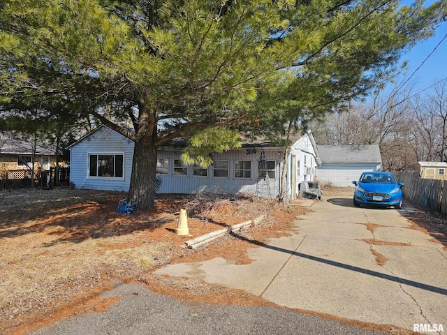 view of front of property featuring fence