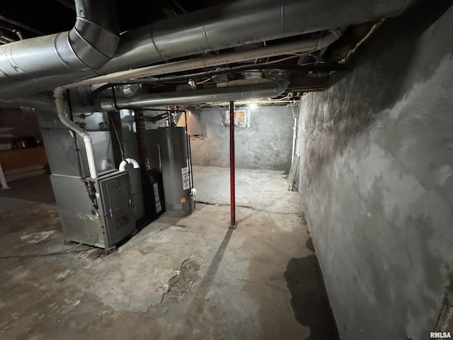 unfinished below grade area with heating unit and water heater