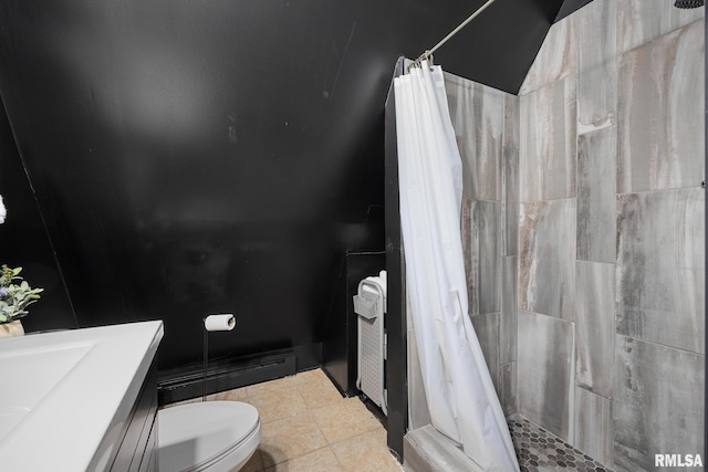 full bathroom with a baseboard radiator, tiled shower, toilet, and tile patterned floors
