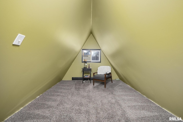 sitting room with lofted ceiling and carpet floors