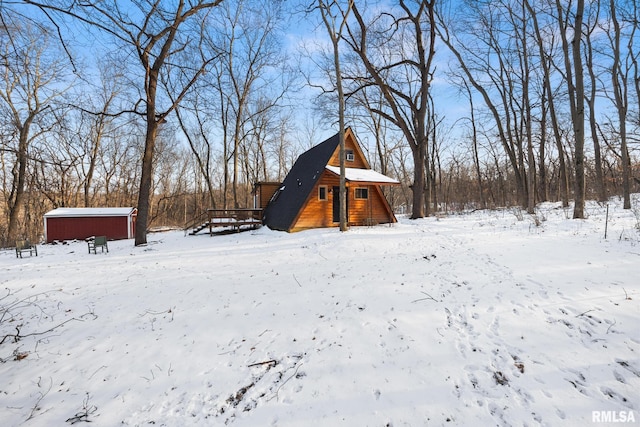 yard layered in snow with a garage