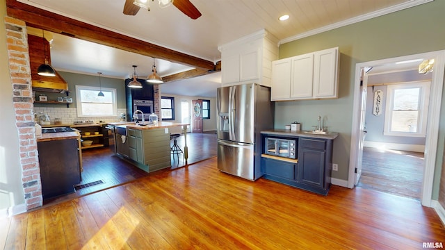 kitchen with visible vents, white cabinets, appliances with stainless steel finishes, hardwood / wood-style floors, and open shelves