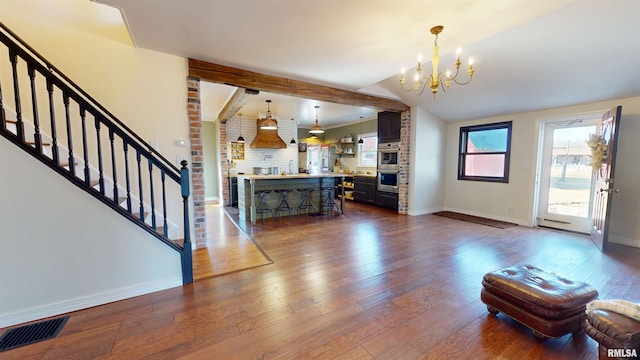 unfurnished living room featuring stairs, dark wood-style flooring, visible vents, and baseboards