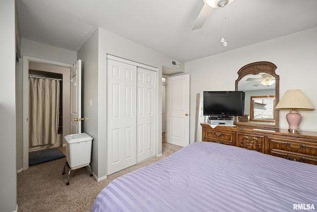 carpeted bedroom with a ceiling fan, a closet, and visible vents