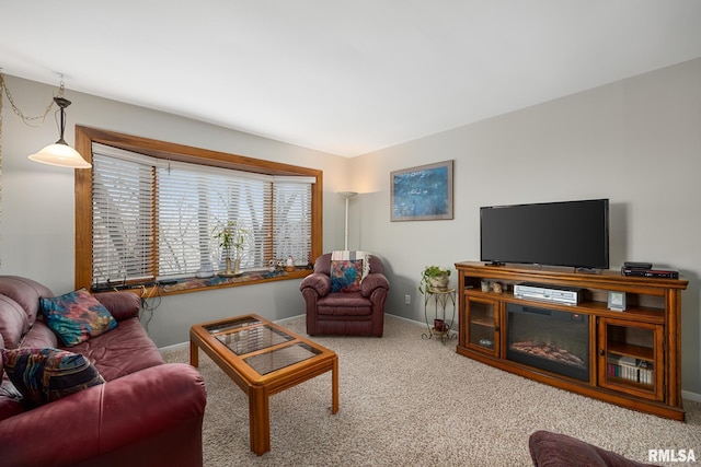 living room with carpet flooring and baseboards