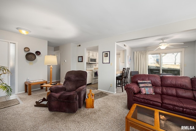 living room with visible vents, baseboards, and carpet flooring