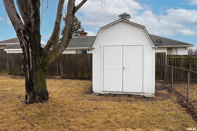 view of shed featuring a fenced backyard