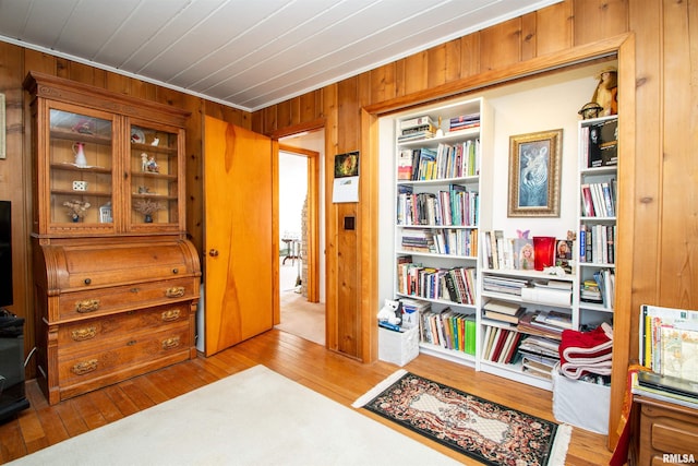 interior space featuring wooden walls and hardwood / wood-style floors