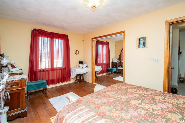 bedroom featuring a closet and hardwood / wood-style flooring