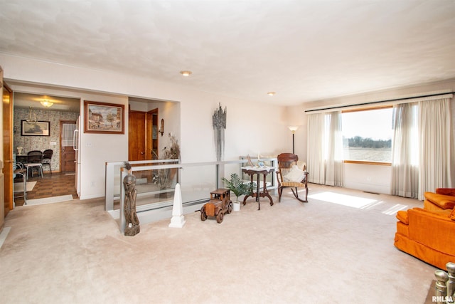 sitting room featuring carpet flooring