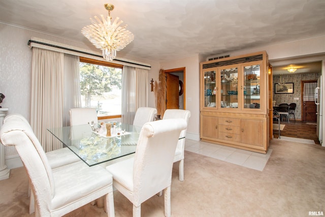 dining room featuring light carpet, wallpapered walls, a brick fireplace, a notable chandelier, and light tile patterned flooring