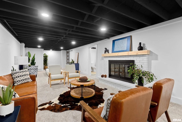 carpeted living room with a brick fireplace and baseboards