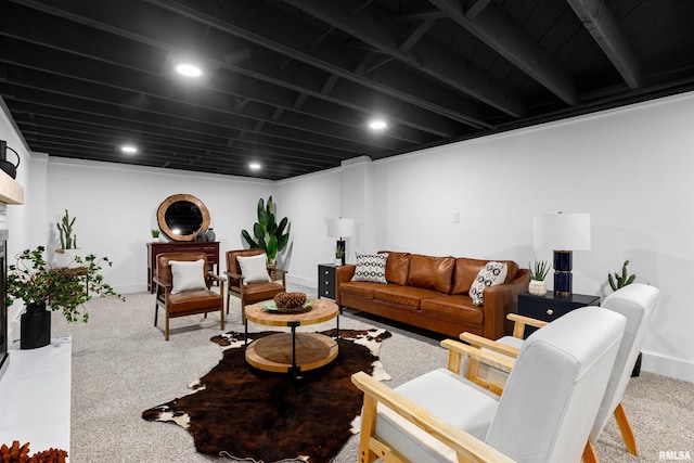 living area featuring baseboards, a fireplace with raised hearth, carpet flooring, and recessed lighting