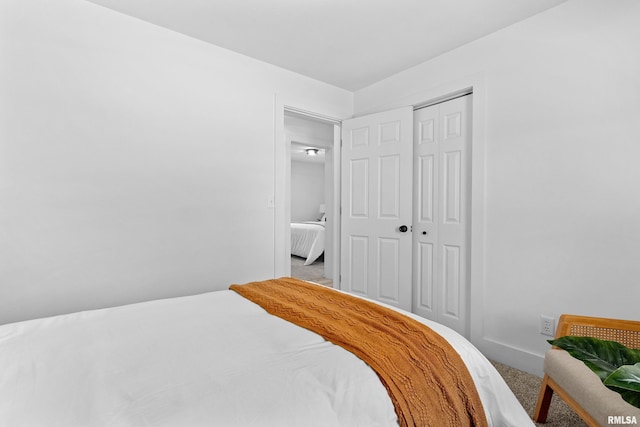 carpeted bedroom featuring a closet