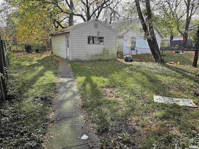 view of yard with an outdoor structure and a fenced backyard