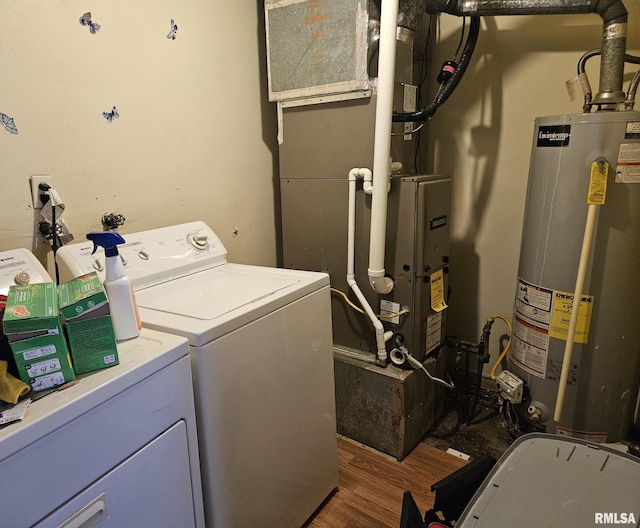 laundry area featuring laundry area, separate washer and dryer, gas water heater, and wood finished floors