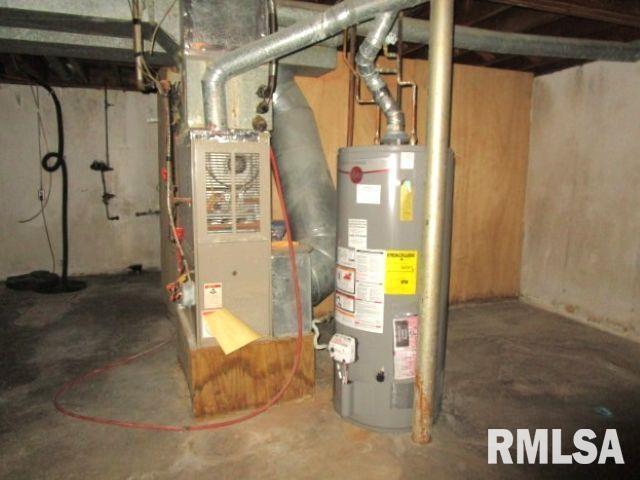 utility room featuring water heater