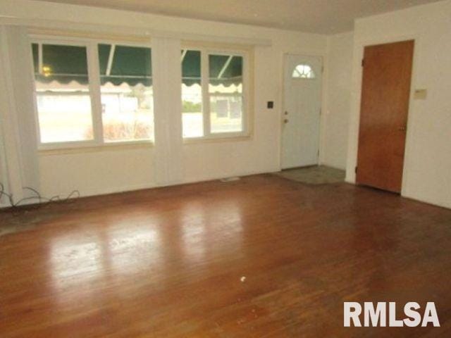 interior space with plenty of natural light and wood finished floors