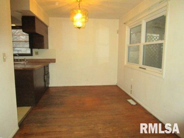 hallway with wood finished floors