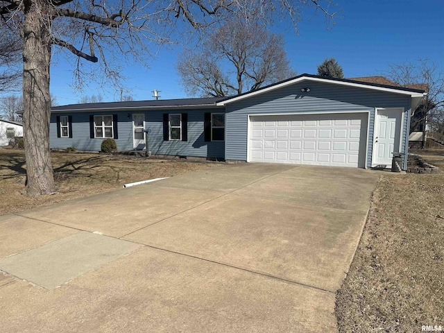 ranch-style house featuring crawl space, driveway, and an attached garage