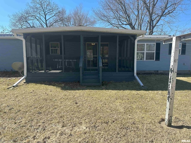 property entrance featuring metal roof, crawl space, and a lawn