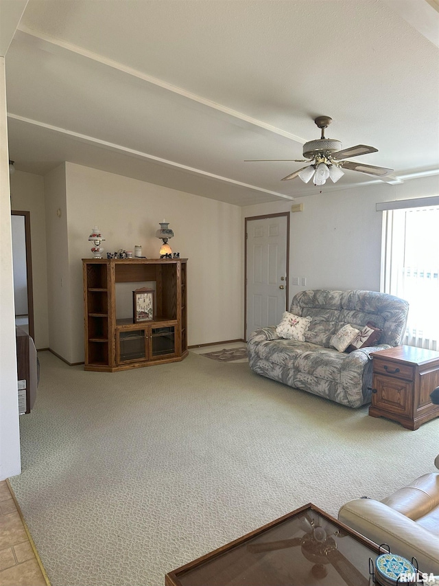 living room with carpet floors and a ceiling fan