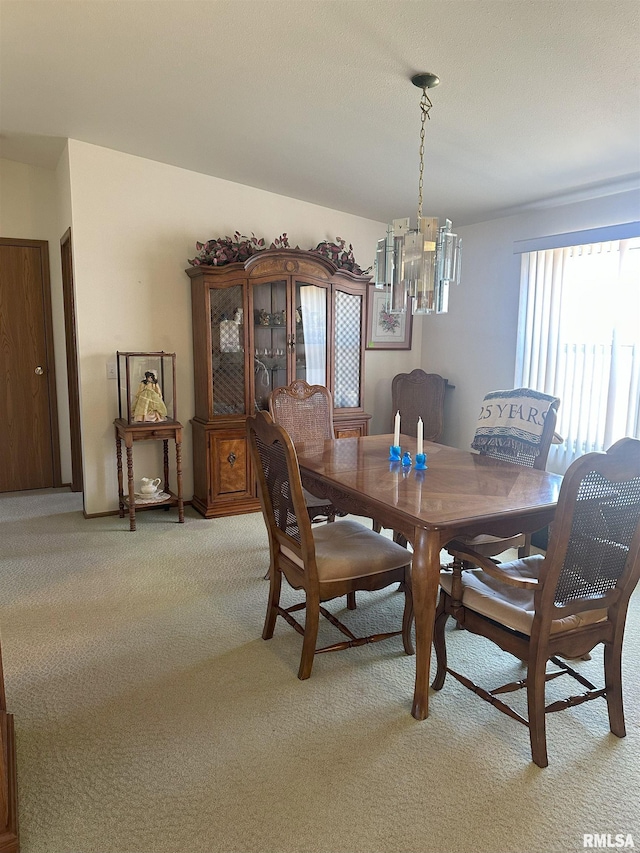 dining room with light carpet