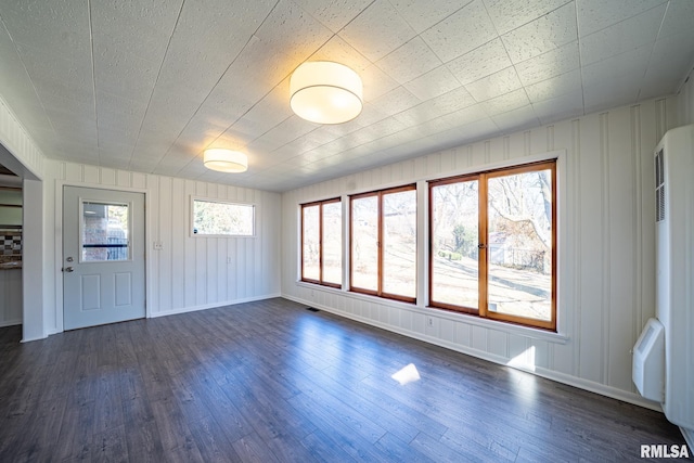 interior space featuring visible vents and dark wood-style flooring