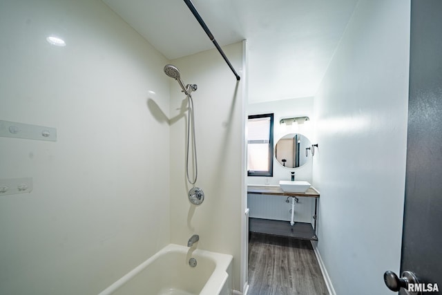 full bathroom with baseboards, vanity, bathtub / shower combination, and wood finished floors