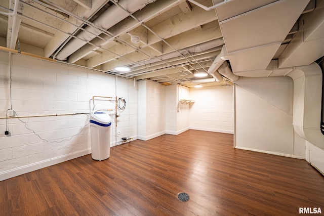 finished basement with baseboards and wood finished floors