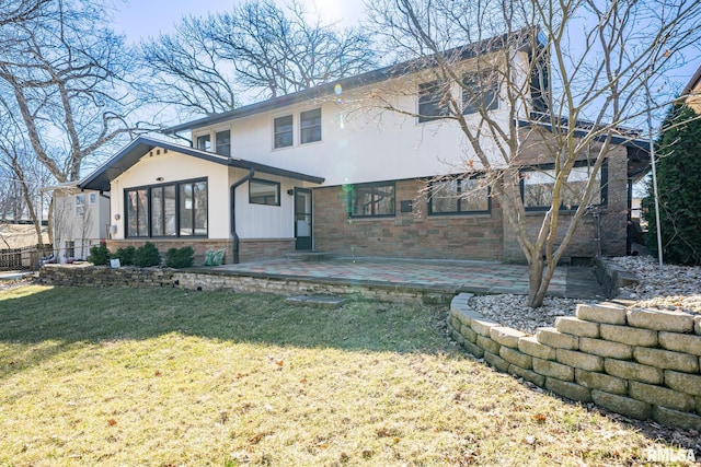 view of front of property featuring a patio area, stone siding, and a front lawn