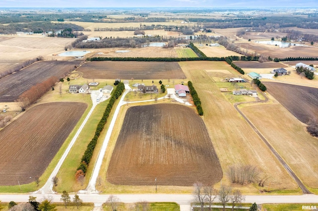 birds eye view of property with a rural view