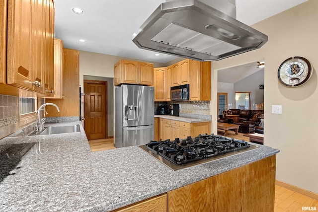 kitchen with stainless steel refrigerator with ice dispenser, backsplash, a sink, gas cooktop, and extractor fan