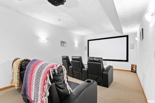 carpeted cinema featuring baseboards