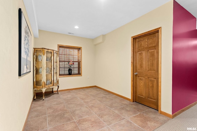 unfurnished room featuring visible vents, baseboards, and recessed lighting