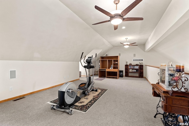 workout area featuring carpet, visible vents, vaulted ceiling, and baseboards