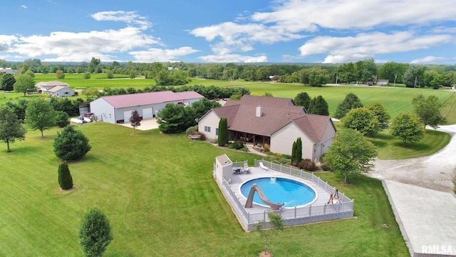 view of swimming pool featuring a fenced in pool, a lawn, a fenced backyard, a water slide, and a patio area