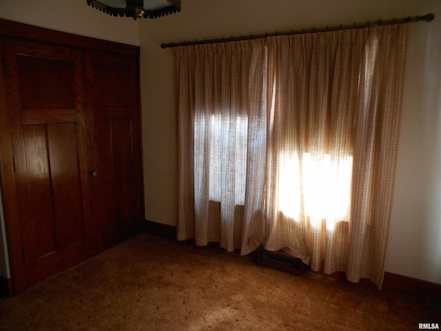 unfurnished bedroom with light colored carpet