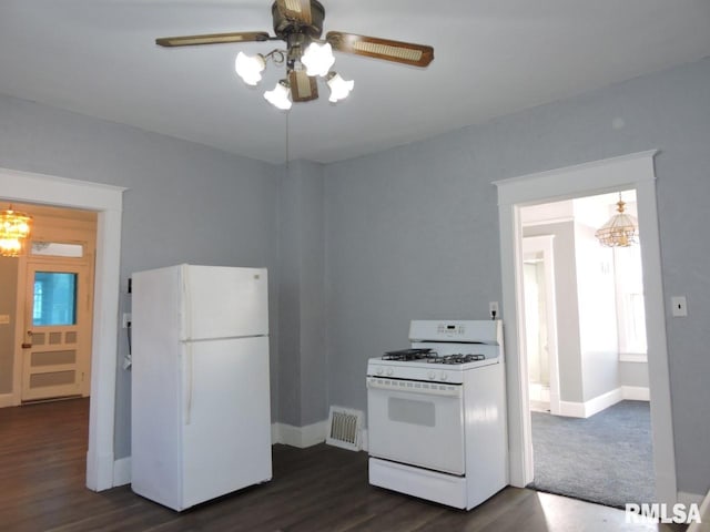 kitchen with ceiling fan with notable chandelier, white appliances, dark wood-type flooring, visible vents, and baseboards