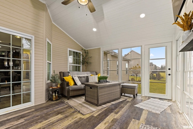 sunroom with a ceiling fan and vaulted ceiling