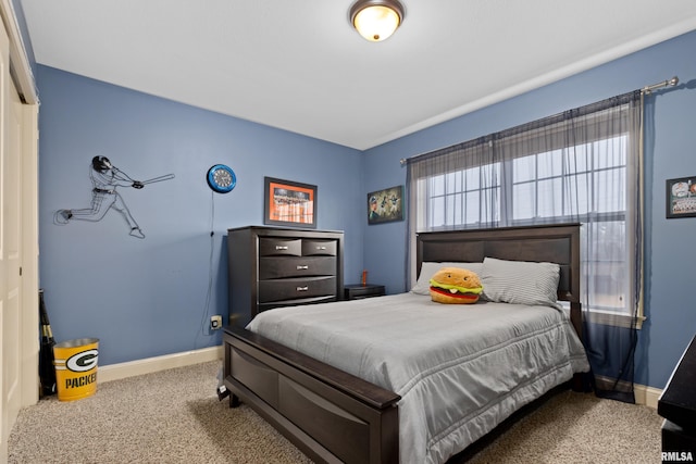 bedroom with carpet and baseboards