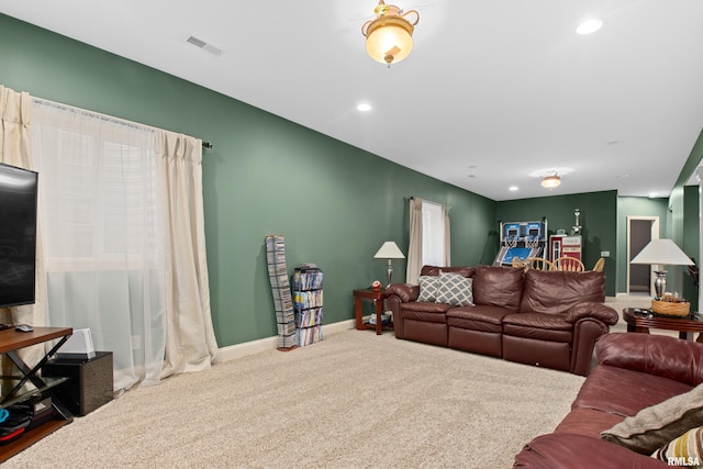 living area with carpet, visible vents, baseboards, and recessed lighting