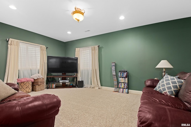 living area with carpet floors, recessed lighting, visible vents, and baseboards