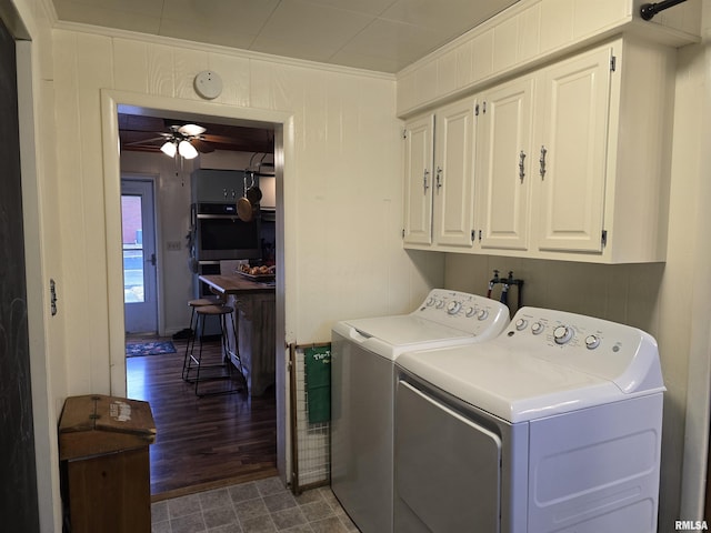 clothes washing area featuring crown molding, washer and clothes dryer, cabinet space, and a ceiling fan