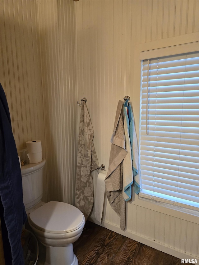 bathroom with wood finished floors and toilet