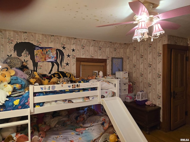 bedroom with wallpapered walls