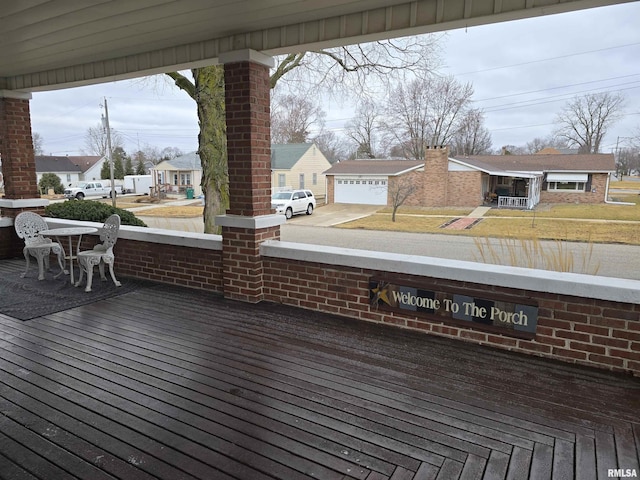 wooden deck with a residential view